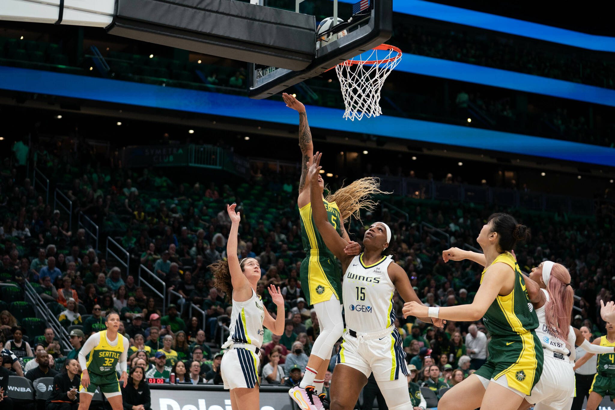 Seattle Storm forward Gabby Williams (5) puts up a shot over Dallas Wings forward Teaira McCowan (15) at Climate Pledge Arena in Seattle on June 3, 2025. (Photo courtesy of the Seattle Storm)