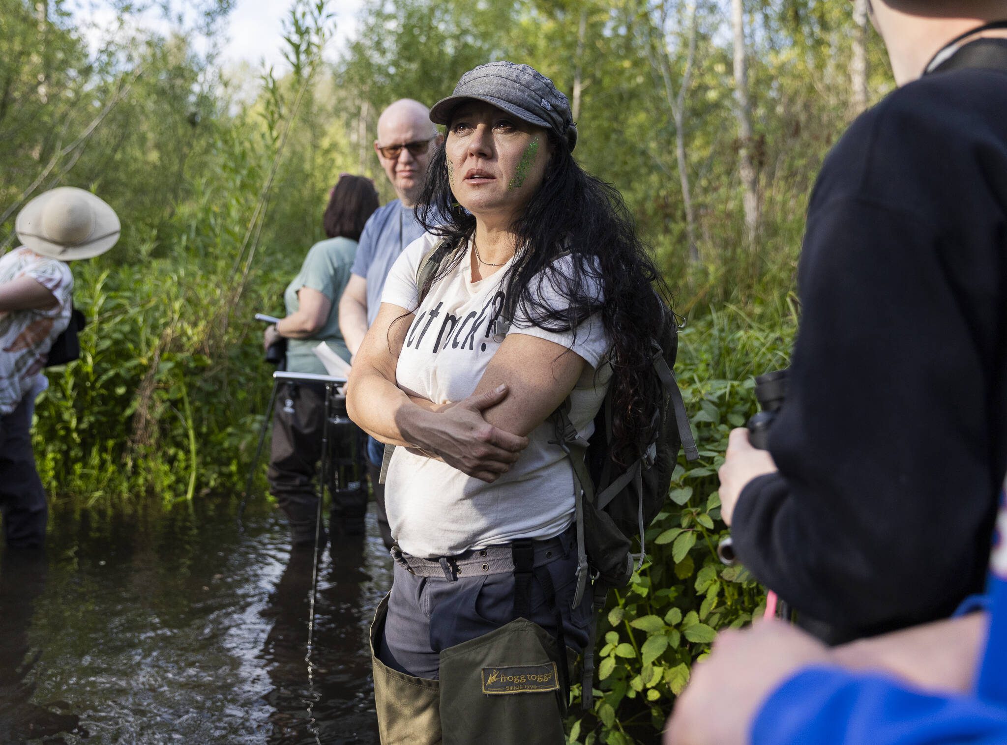 Cascadia College Earth and Environmental Sciences Professor Midori Sakura looks in the surrounding trees for wildlife at the North Creek Wetlands on Wednesday, June 4, 2025 in Bothell, Washington. (Olivia Vanni / The Herald)