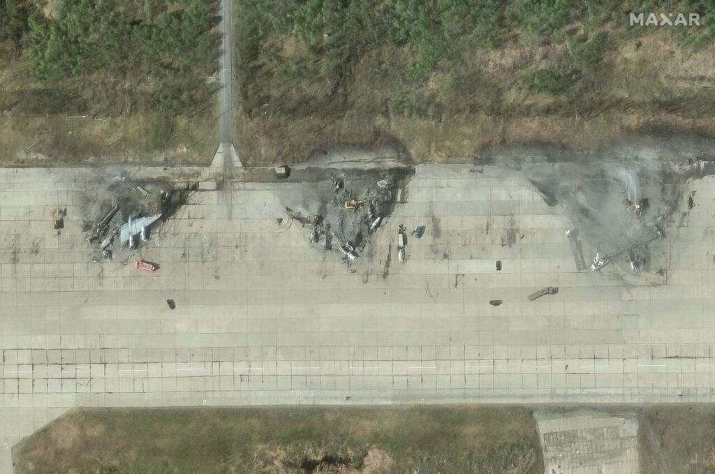 A satellite image from Maxar Technologies shows destroyed aircraft in the aftermath of a drone strike at the Olenya air base, Murmansk region, Russia, June 4. On June 1, remotely operated Ukrainian drones emerged from hiding inside Russia and began wreaking damage and when they were done, at least a dozen military aircraft lay in ruins. (Satellite image ©2025 Maxar Technologies via The New York Times)
