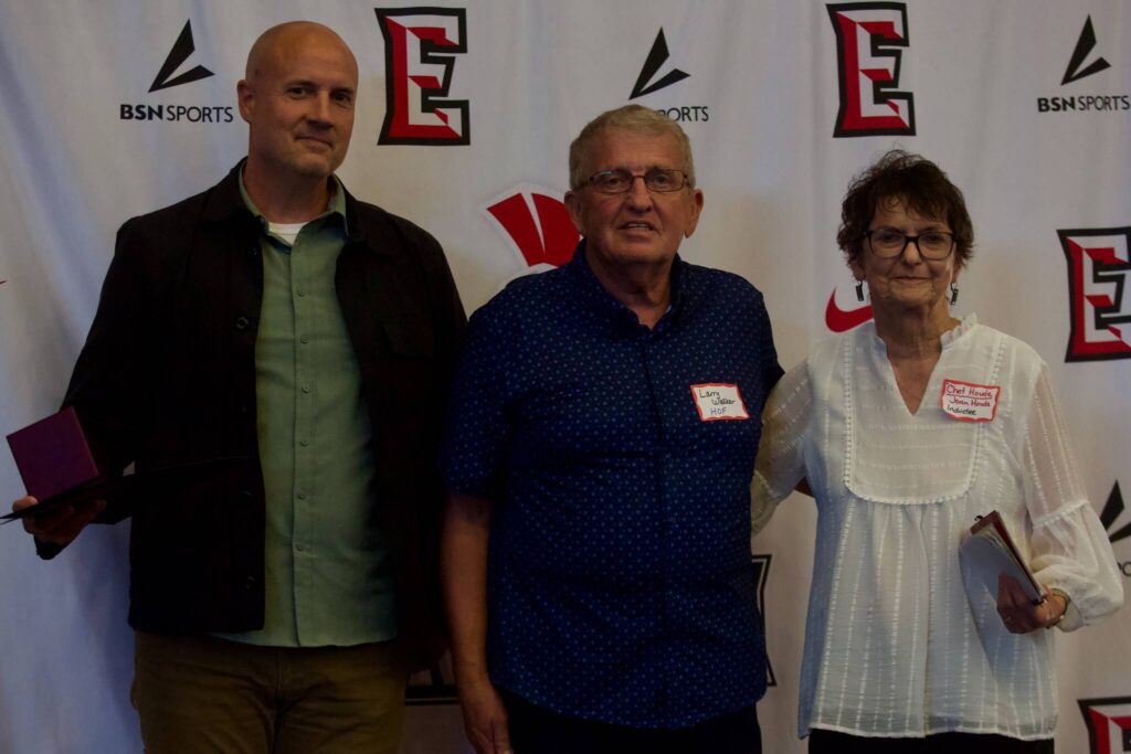 The late Chet Hovde’s son, Ryan (left), and wife Joan (right), pose with EvCC Hall of Famer Larry Walker at the Everett Community College Athletics 2025 Hall of Fame Induction Ceremony in Everett, Washington on June 5, 2025. Chet Hovde won 442 games in 33 years as the women’s basketball head coach at EvCC. (Joe Pohoryles / The Herald)
