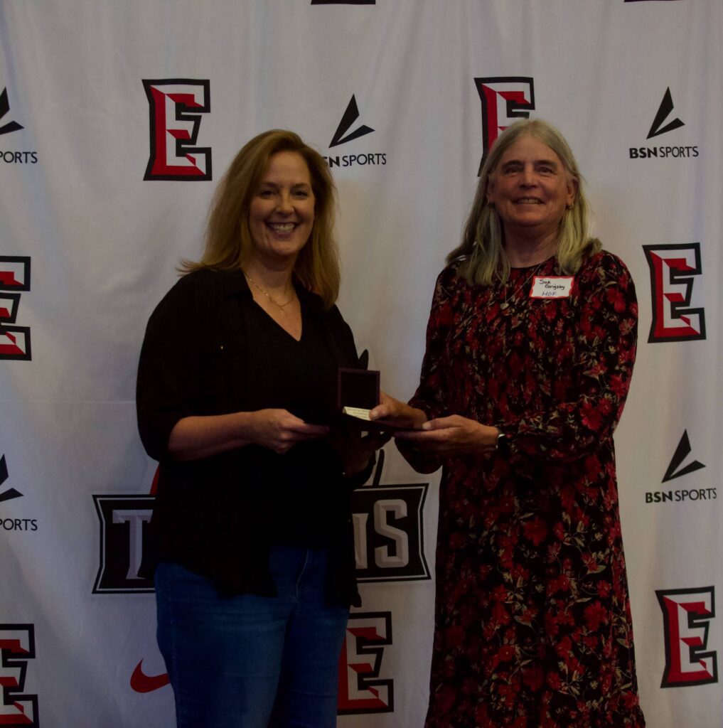 EvCC Hall of Famer Sue Grigsby presents Erica Ryan with her award at the Everett Community College Athletics 2025 Hall of Fame Induction Ceremony in Everett, Washington on June 5, 2025. Ryan starred on the 2001-02 women’s basketball team under coach Chet Hovde. (Joe Pohoryles / The Herald)
