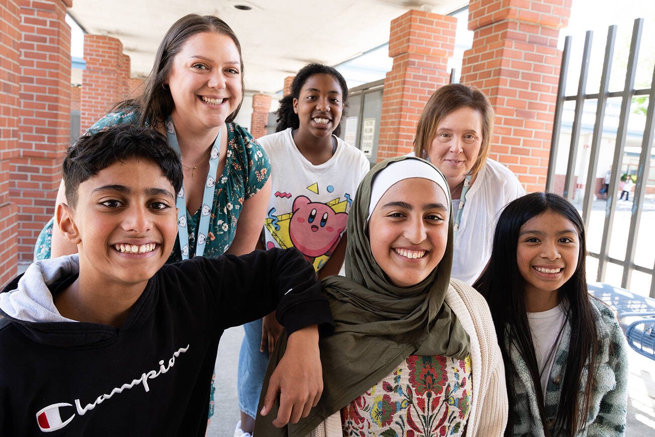 Students attending Camp Killoqua next week pose with Olivia Park Elementary staff on Friday, June 6 near Everett. Top, from left: Stacy Goody, Cecilia Stewart and Lynne Peters. Bottom, from left: Shaker Alfaly, Jenna Alfaly and Diana Peralta. (Will Geschke / The Herald)