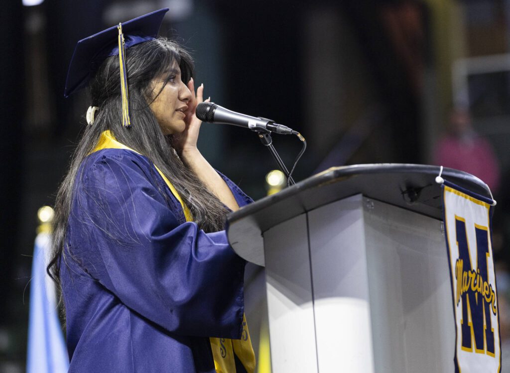 Tasmeen Sheikh, valedictorian for the Mariner High School class of 2025 wipes away a tear after becoming emotional during her speech at commencement on Friday, June 13, 2025, at Angel of the Winds Arena in Everett, Washington. (Olivia Vanni / The Herald)
