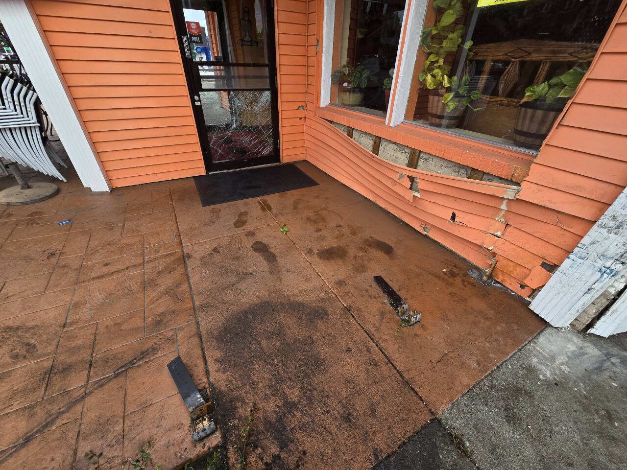A car crashed into the front of Los Novillos Family Mexican Restaurant just seconds before the driver was apprehended by local law enforcement Thursday, June 12, 2025, in Everett, Washington. (Aaron Kennedy/The Herald)