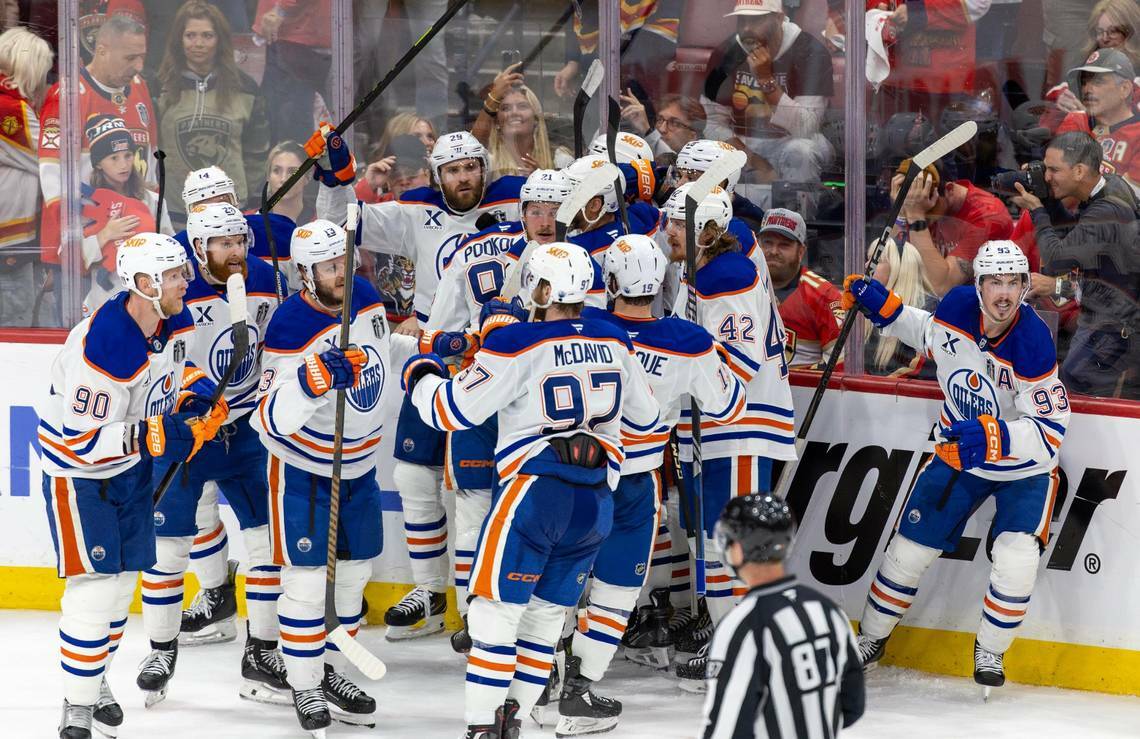Edmonton Oilers center Leon Draisaitl (29) celebrates with teammates after scoring the game-winning goal in overtime against the Florida Panthers during Game 4 of the NHL Stanley Cup Final at Amerant Bank Arena on Thursday, June 12, 2025, in Sunrise, Fla. (David Santiago / Tribune News Services)