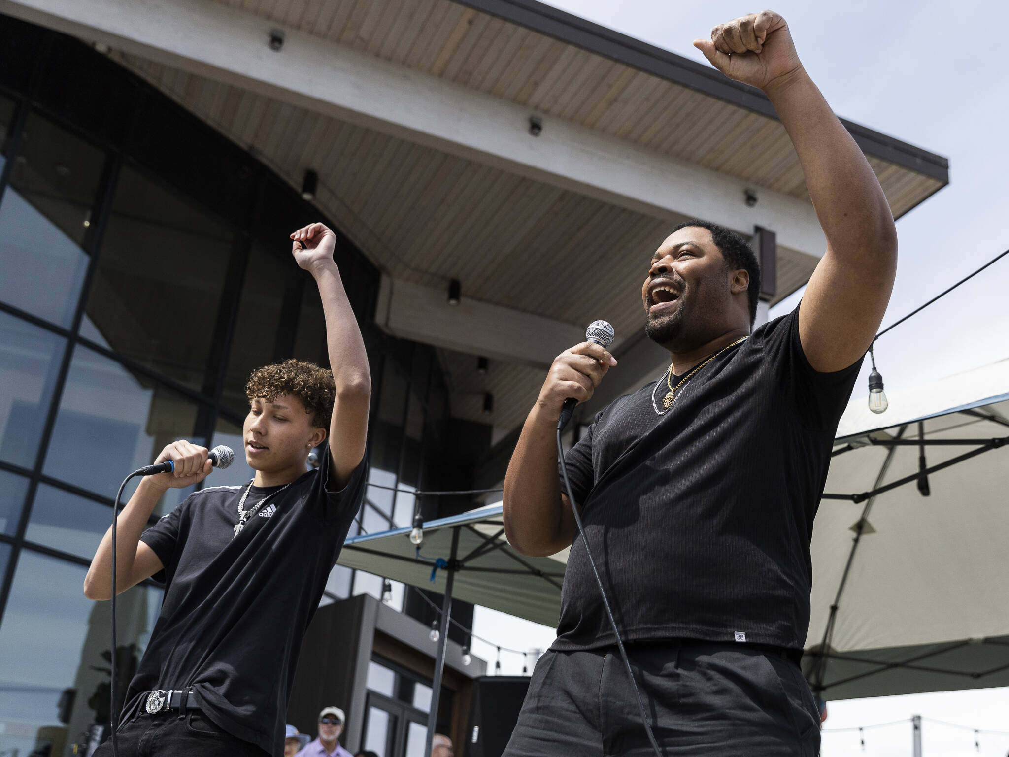 William Luckett, right, and JJ perform a spoken word piece during Juneteenth at the Beach’s Festival of Freedom on Thursday, June 19, 2025 in Edmonds, Washington. (Olivia Vanni / The Herald)