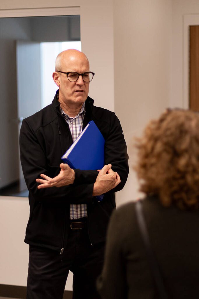 U.S. Rep. Rick Larsen, D-Everett, speaks with Katie Gilligan, chief health officer at Compass Health, during Wednesday’s tour of the new facility in Everett.
