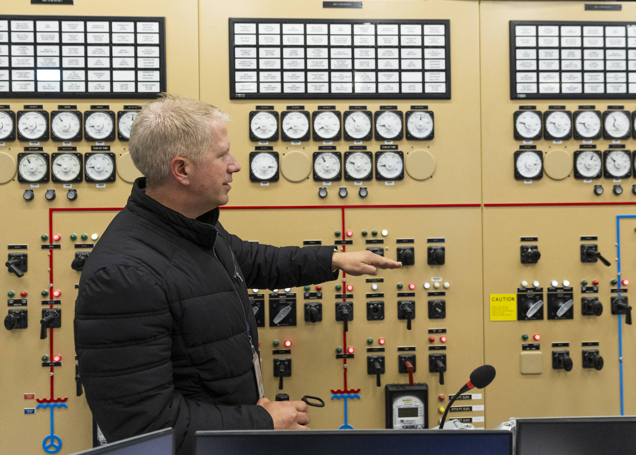 PUD Manager of Generation Operation and Engineering Scott Spahr talks about the different gauges and monitoring on the control panel at the Henry M. Jackson Hydroelectric Project on Wednesday, June 18, 2025 in Sultan, Washington. (Olivia Vanni / The Herald)
