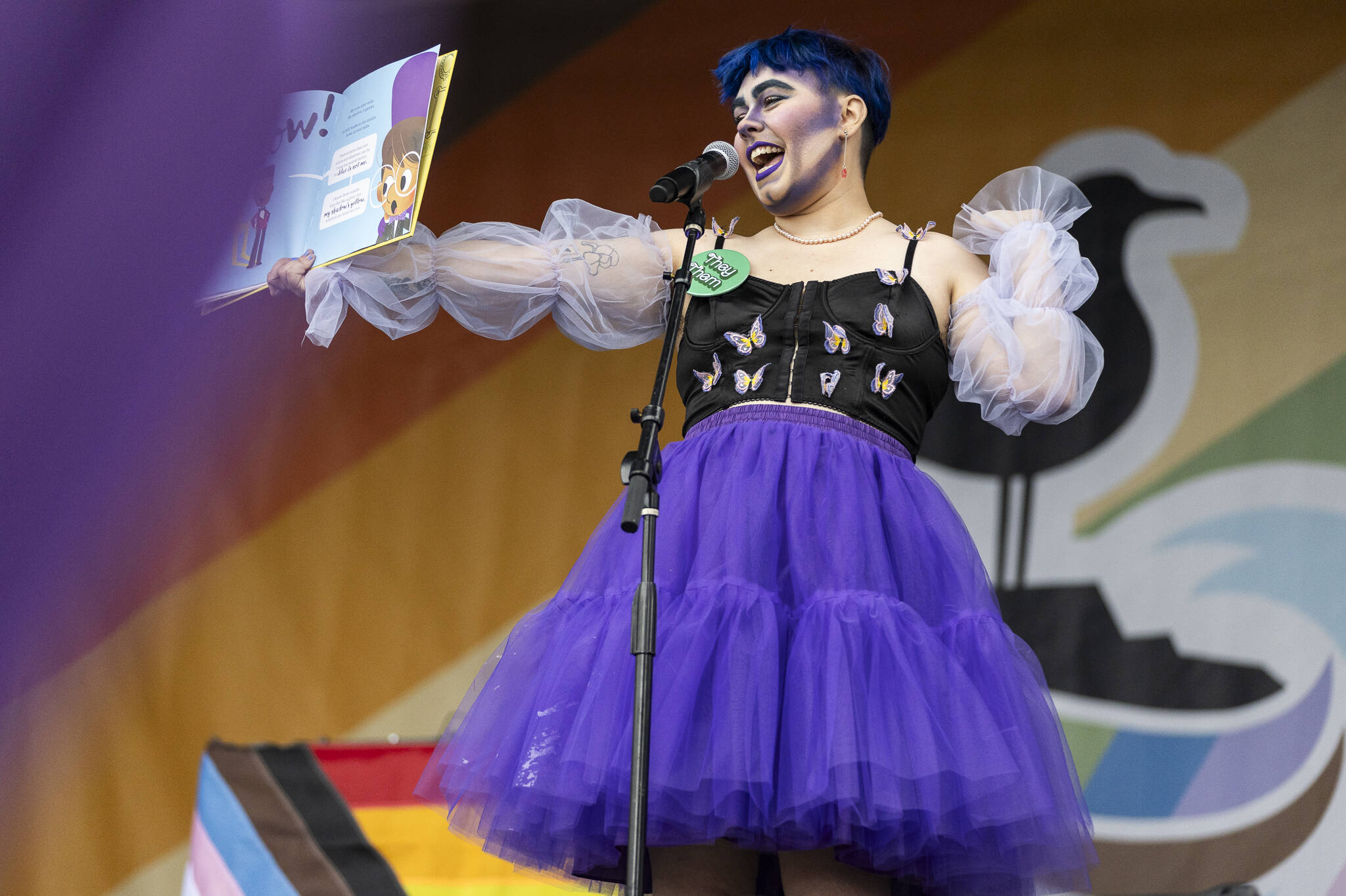 Mx. Kenbie reads ‘My Shadow is Purple’ during the Everett Pride Block Party on Saturday, June 21, 2025 in Everett, Washington. (Olivia Vanni / The Herald)