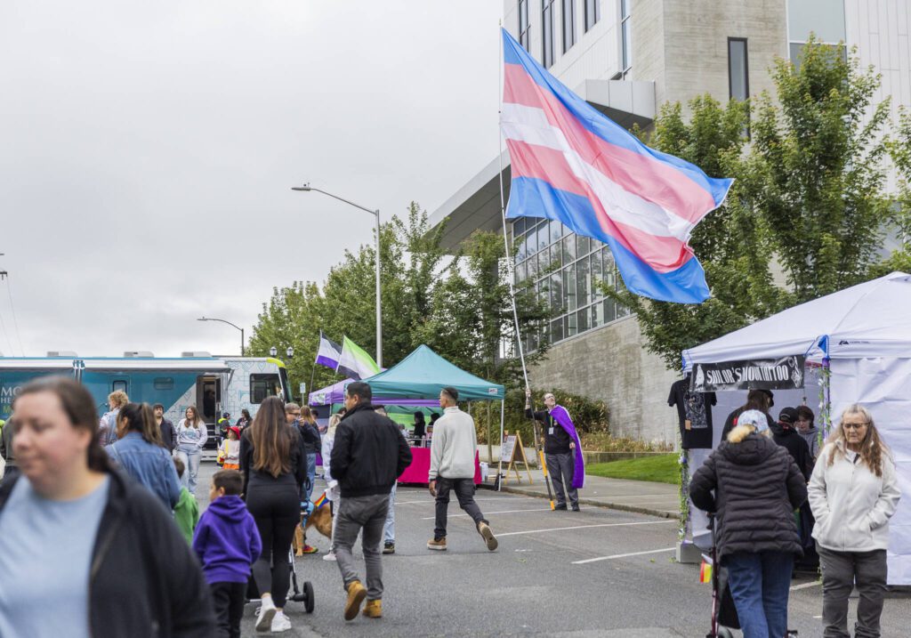 A large transgender flag flies during the Everett Pride Block Party on Saturday, June 21, 2025 in Everett, Washington. (Olivia Vanni / The Herald)
