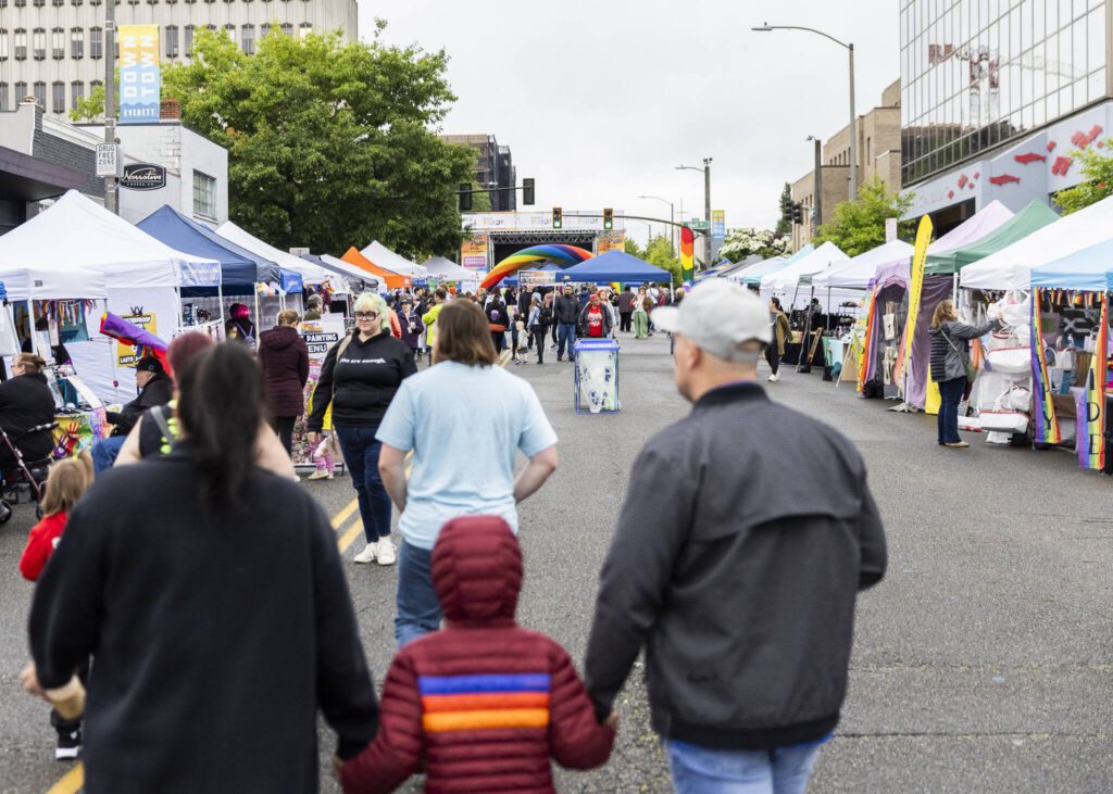 People explore the Everett Pride Block Party on Saturday, June 21, 2025 in Everett, Washington. (Olivia Vanni / The Herald)
