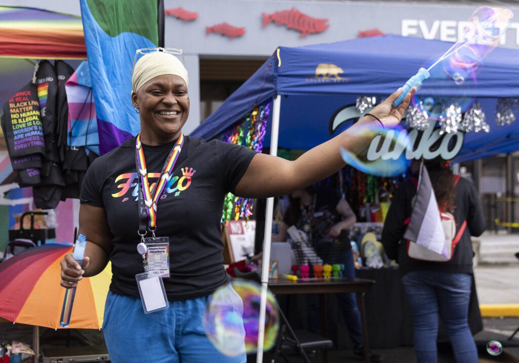 Sani Burgess creates bubbles outside of the Funko booth during the Everett Pride Block Party on Saturday, June 21, 2025 in Everett, Washington. (Olivia Vanni / The Herald)
