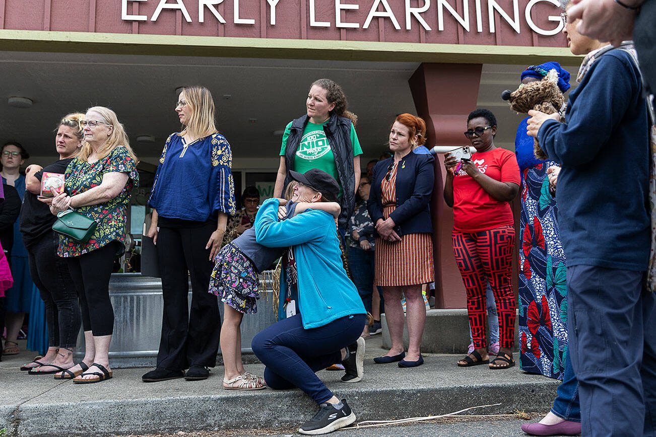 Student Azhura Brown, 5, hugs teacher Rebecca Baggenstoss on Wednesday, June 25, 2025 in Everett, Washington. (Olivia Vanni / The Herald)