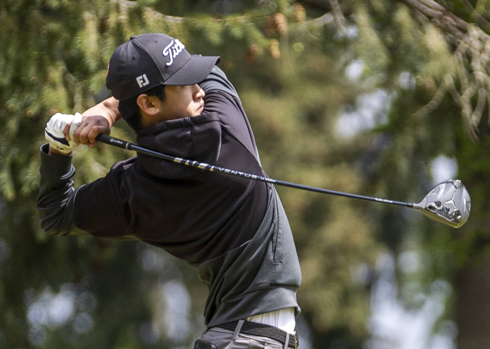 Jackson’s Jacob Kang hits a drive during the 4A District 1 Boys Golf Championship at Legion Memorial Golf Course on Tuesday, May 13, 2025 in Everett, Washington. (Olivia Vanni / The Herald)