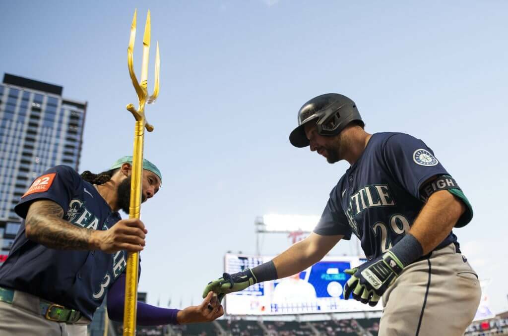 Seattle Mariners catcher Cal Raleigh (29) celebrates with shortstop JP Crawford (3). (Stephen Maturen / Getty Images / The Athletic)