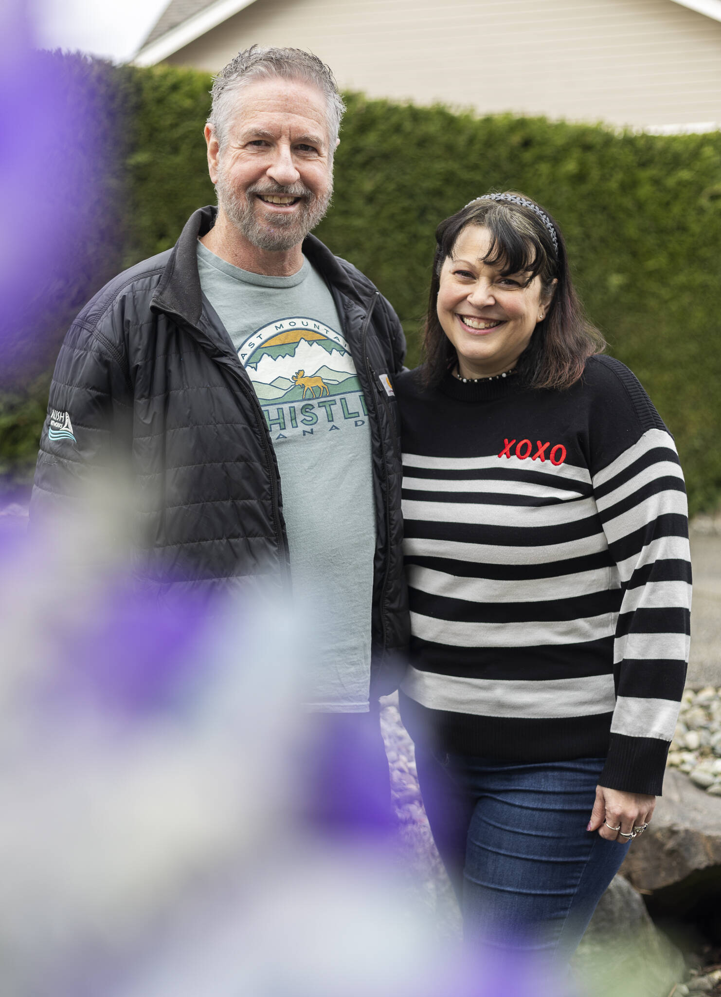 Snohomish County Dahlia Society members Doug Symonds and Alysia Obina on Monday, March 3, 2025 in Lake Stevens, Washington. (Olivia Vanni / The Herald)