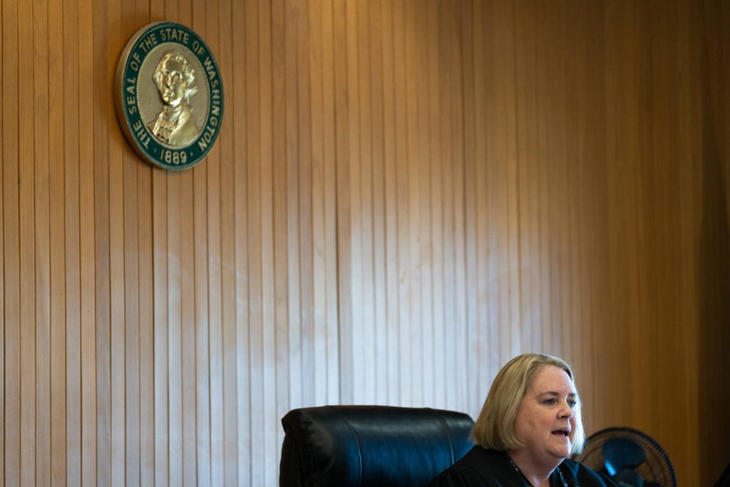 Judge Millie Judge reads Christian Sayre’s sentence during a hearing Monday, July 21 at the Snohomish County Courthouse in Everett, Washington. (Will Geschke / The Herald)

