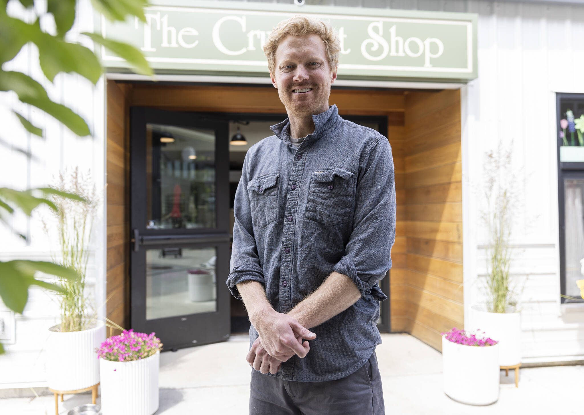 The Crumpet Shop owner Cooper Golding outside of their new location on Tuesday, June 24, 2025 in Edmonds, Washington. (Olivia Vanni / The Herald)