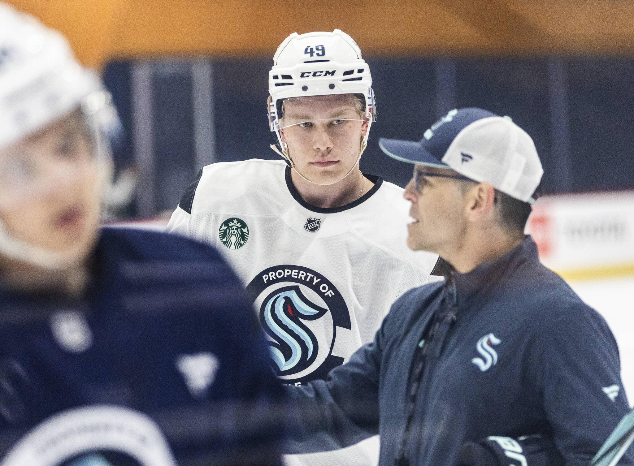Julius Miettinen listens to a coach during Kraken Development Camp on-ice session for forwards on Tuesday, July 1, 2025 in Seattle, Washington. (Olivia Vanni / The Herald)