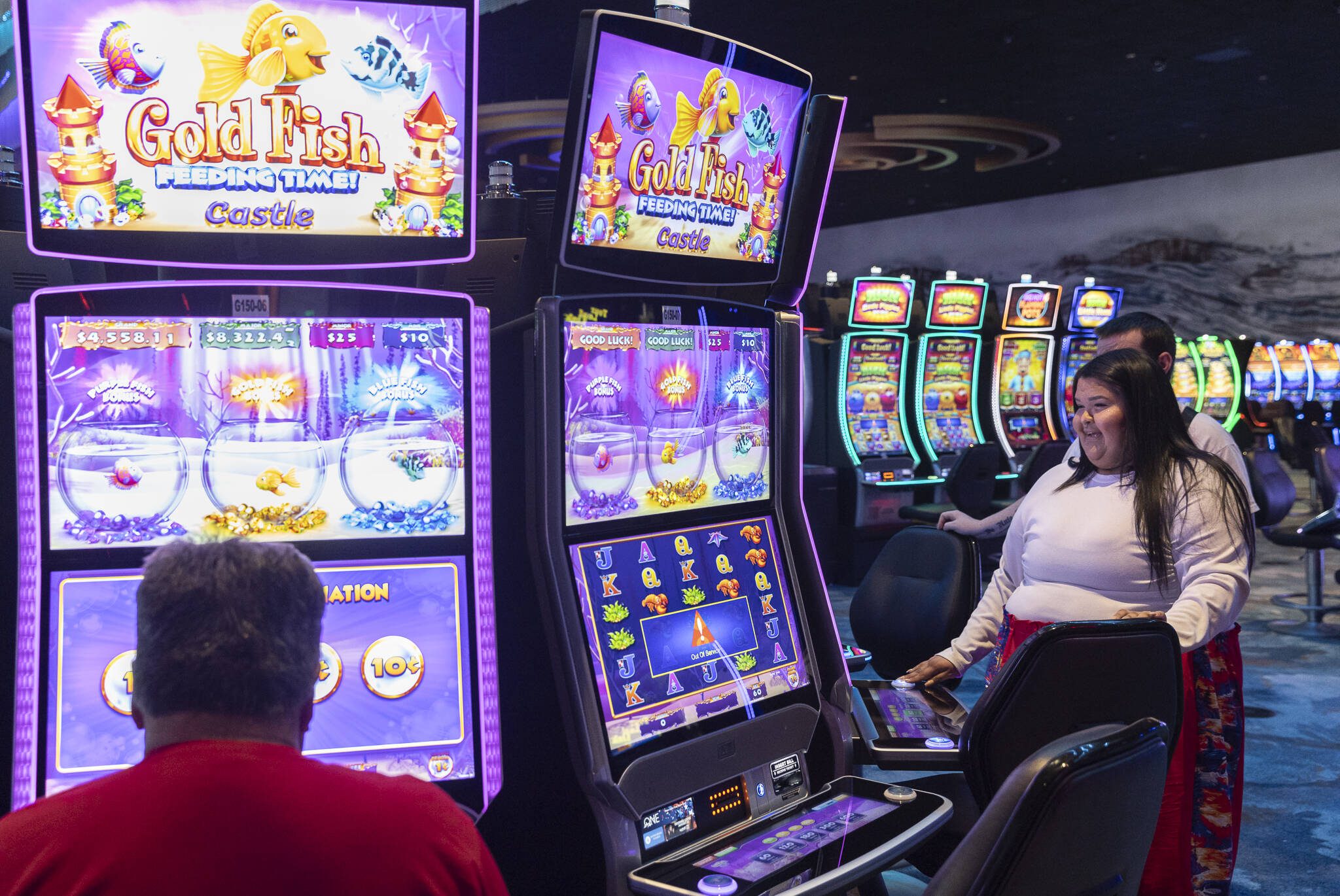 Toneena Gobin plays one of the slot games during the opening of the expansion of the Tulalip Casino on Thursday, July 3, 2025 in Tulalip, Washington. (Olivia Vanni / The Herald)
