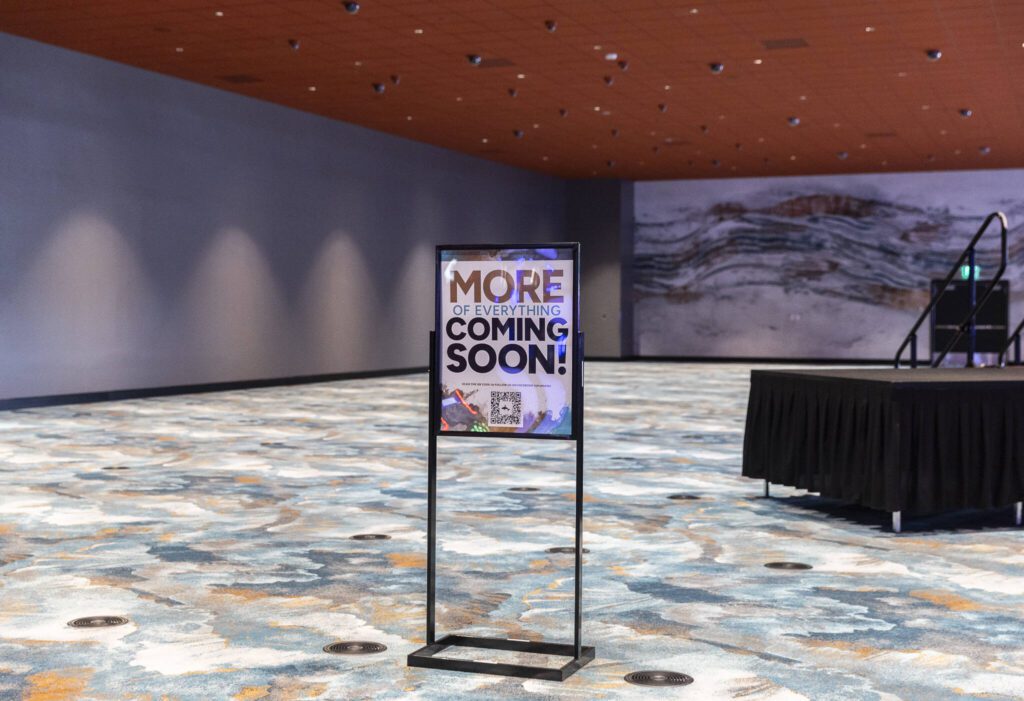 A sign announcing “more of everything coming soon” on display in an empty part of the Tulalip Resort Casino expansion on Thursday, July 3, 2025 in Tulalip, Washington. (Olivia Vanni / The Herald)
