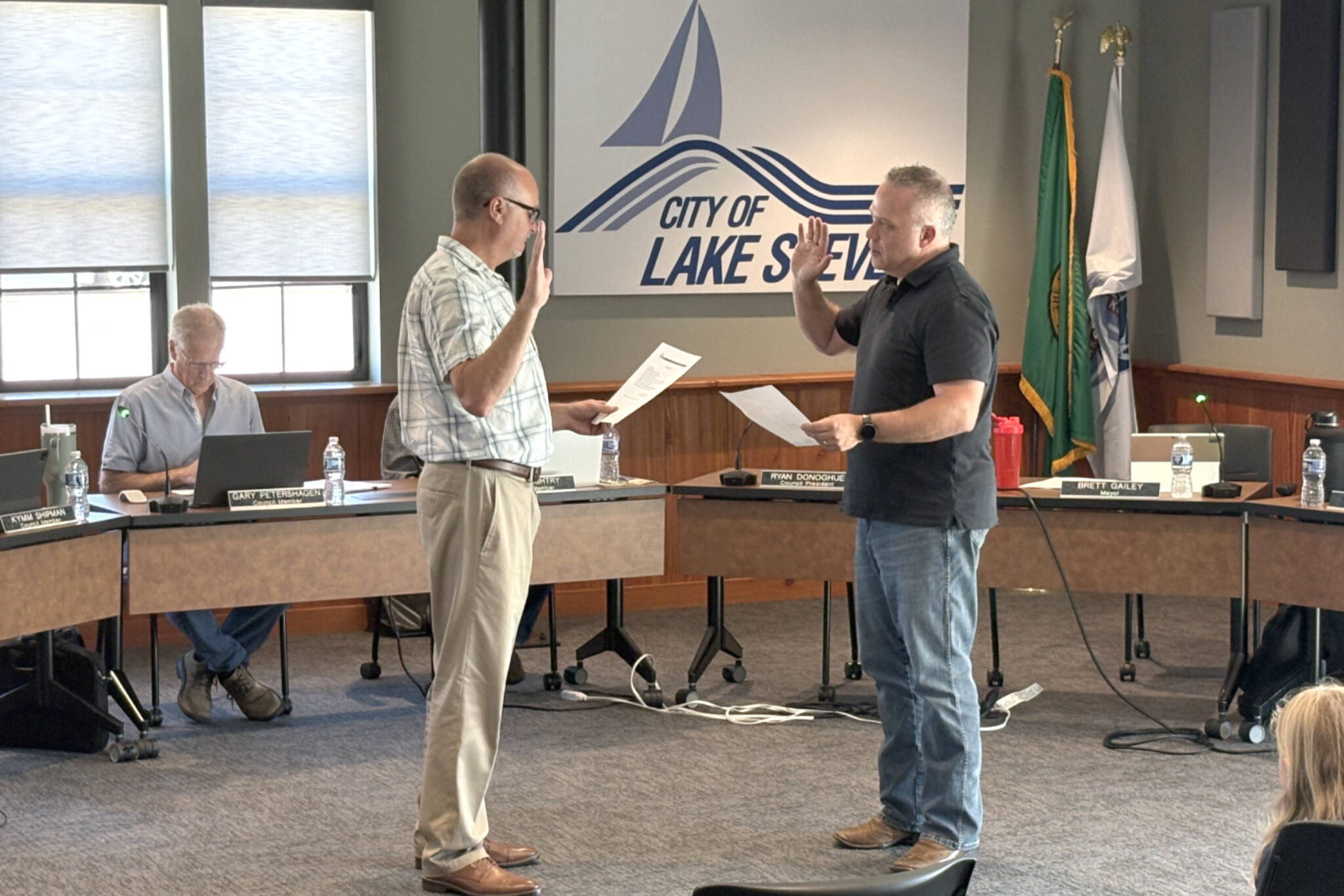 Lake Stevens Mayor Brett Gailey, right, swears in Kurt Hilt as the newest member of the Lake Stevens City Council on Tuesday, July 1, 2025, in Lake Stevens, Washington. (Taylor Richmond / The Herald)