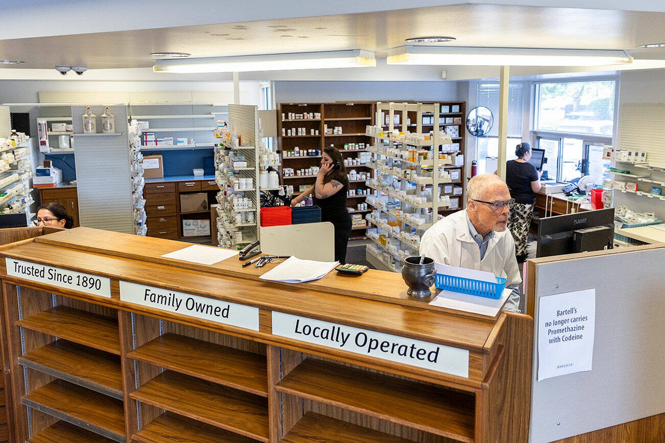 Pharmacist John Sontra and other employees work on calling customers to get their prescriptions transferred to other stores from the Bartell Drugs Pharmacy on Hoyt Avenue on Wednesday, July 2, 2025 in Everett, Washington. (Olivia Vanni / The Herald)