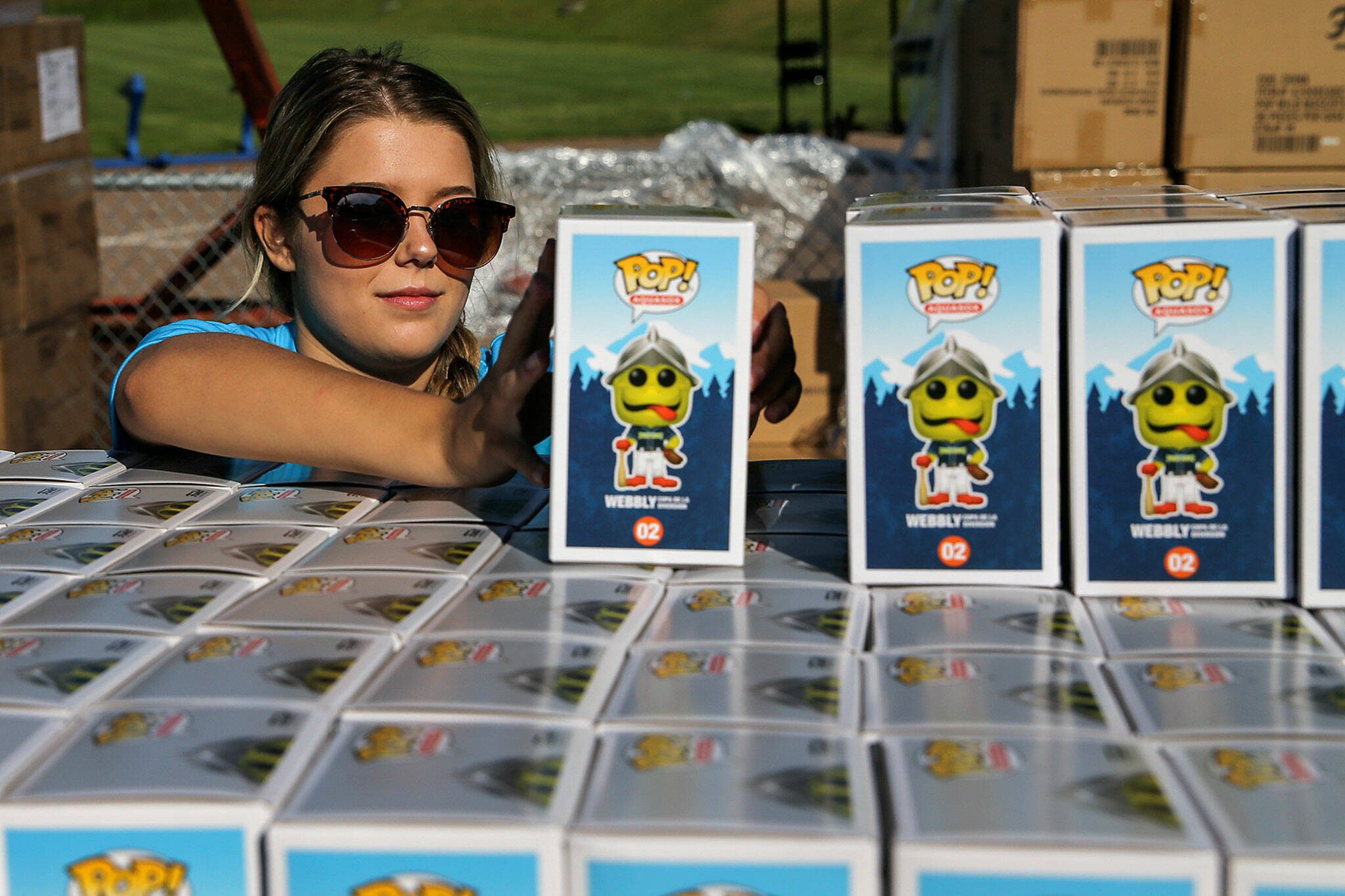 Lily Lamoureux stacks Weebly Funko toys in preparation for Funko Friday at Funko Field in Everett on July 12, 2019. On Monday, the company announced board member Michael Lunsford as interim CEO, replacing outgoing CEO Cynthia Williams, effective July 5. (Kevin Clark / The Herald)