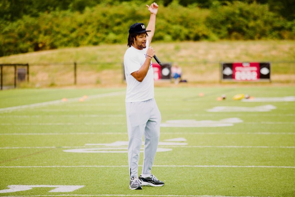 Rome Odunze addresses the campers at his youth football camp at Archbishop Murphy High School on July 10, 2025. (Joe Pohoryles / The Herald)
