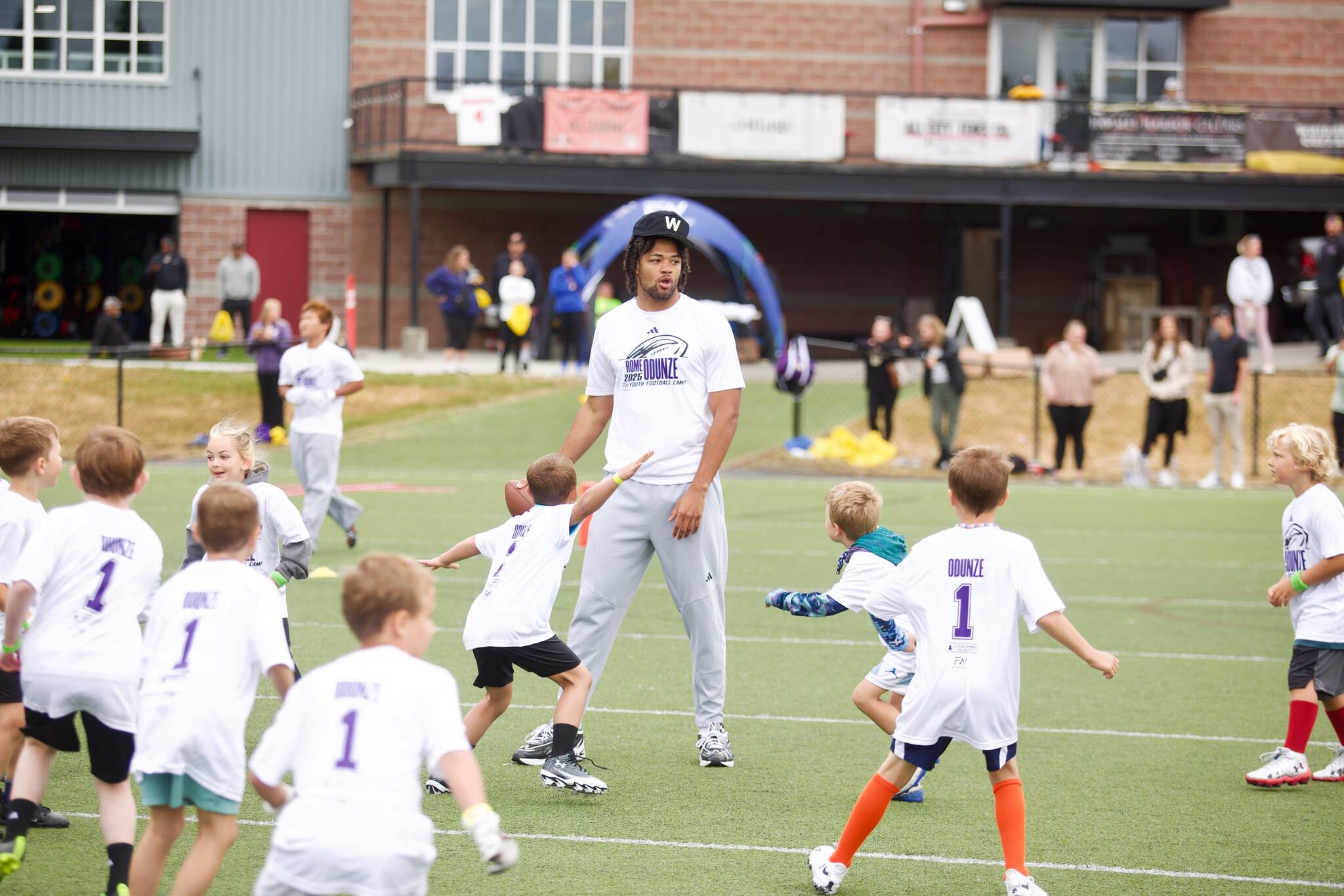 Rome Odunze scans the field in a scrimmage at his youth football camp at Archbishop Murphy High School on July 10, 2025. The former University of Washington star is entering his second NFL season with the Chicago Bears. (Joe Pohoryles / The Herald)