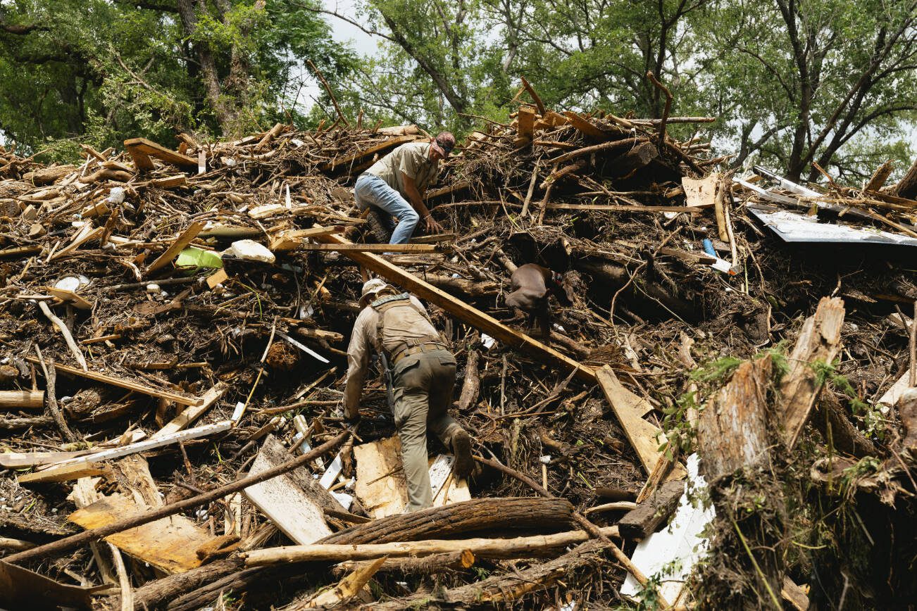 Authorities search for victims among the rubble near Blue Oak RV park after catastrophic flooding on the Guadalupe River in Kerrville, Texas, on Sunday, July 6, 2025. The half-mile stretch occupied by two campgrounds appears to have been one of the deadliest spots along the Guadalupe River in Central Texas during last week’s flash floods. (Jordan Vonderhaar/The New York Times)