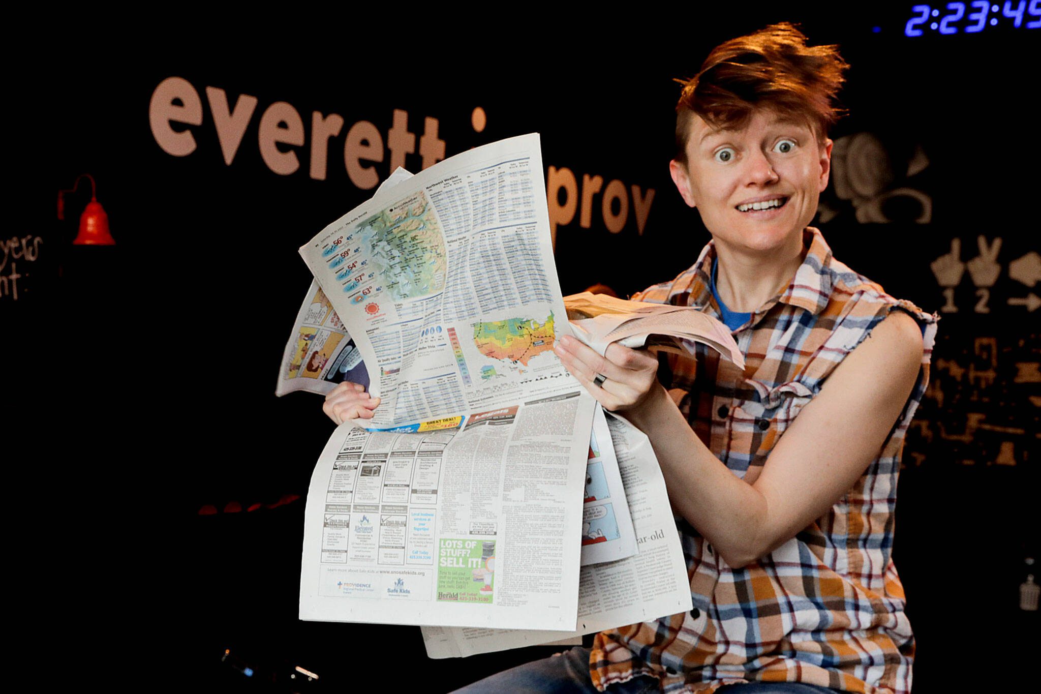 Britney Barber, owner of Everett Improv. Barber performs a show based on clippings from The Daily Herald. Photographed in Everett, Washington on May 16, 2022. (Kevin Clark / The Herald)