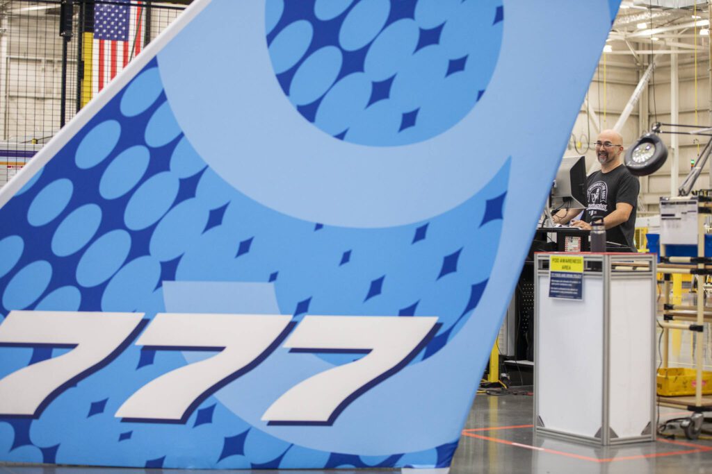 Casey McDowell, a composite spar machine operator, waits during a countdown to drill the first hole in the 777-8 Freighter wing spar on Monday, July 21, 2025 in Everett, Washington. (Olivia Vanni / The Herald)
