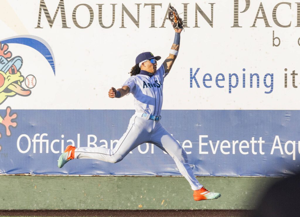 Everett AquaSox outfielder Tai Peete leaps in the air to make a catch during the game against the Spokane Indians on Tuesday, July 22, 2025 in Everett, Washington. (Olivia Vanni / The Herald)
