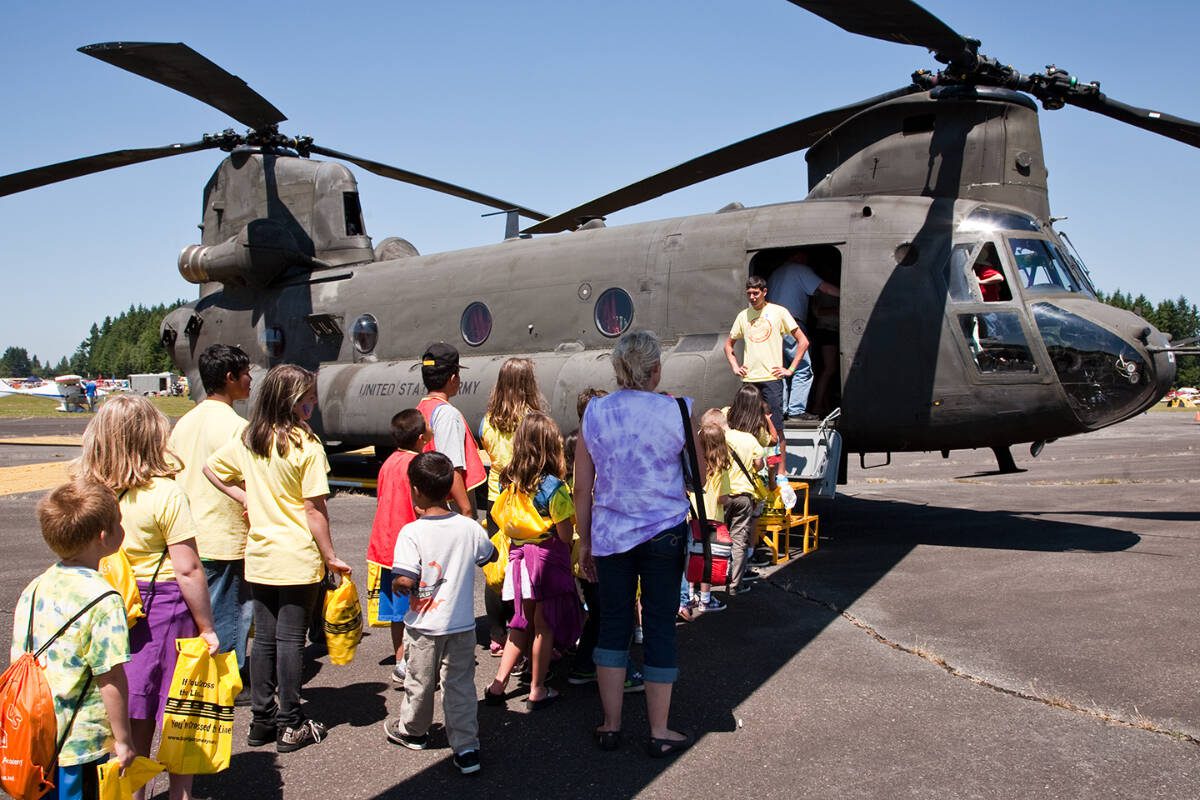 File photo 
People wait in line to see a U.S. Army Chinook helicopter being exhibited in 2022 at Arlington SkyFest.
