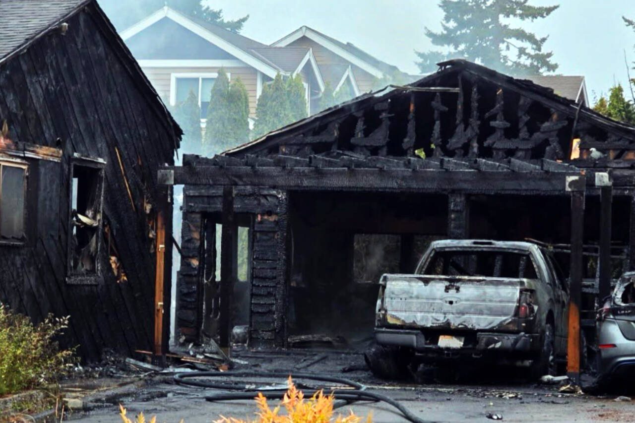 Flames and smoke destroyed an Edmonds home’s garage and significantly damaged the main house and two vehicles early Friday morning, July 25, 2025 near Lake Ballinger. (Provided photo)