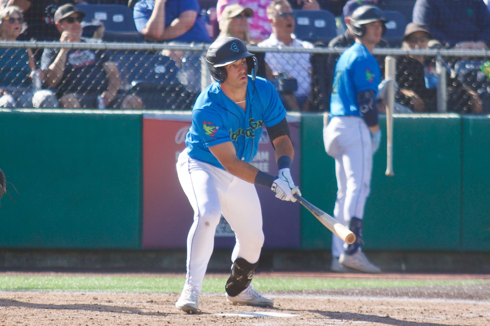 AquaSox infielder Brandon Eike watches the ball off his bat during Everett’s 7-4 loss to the Spokane Indians at Funko Field on July 27, 2025. (Joe Pohoryles / The Herald)