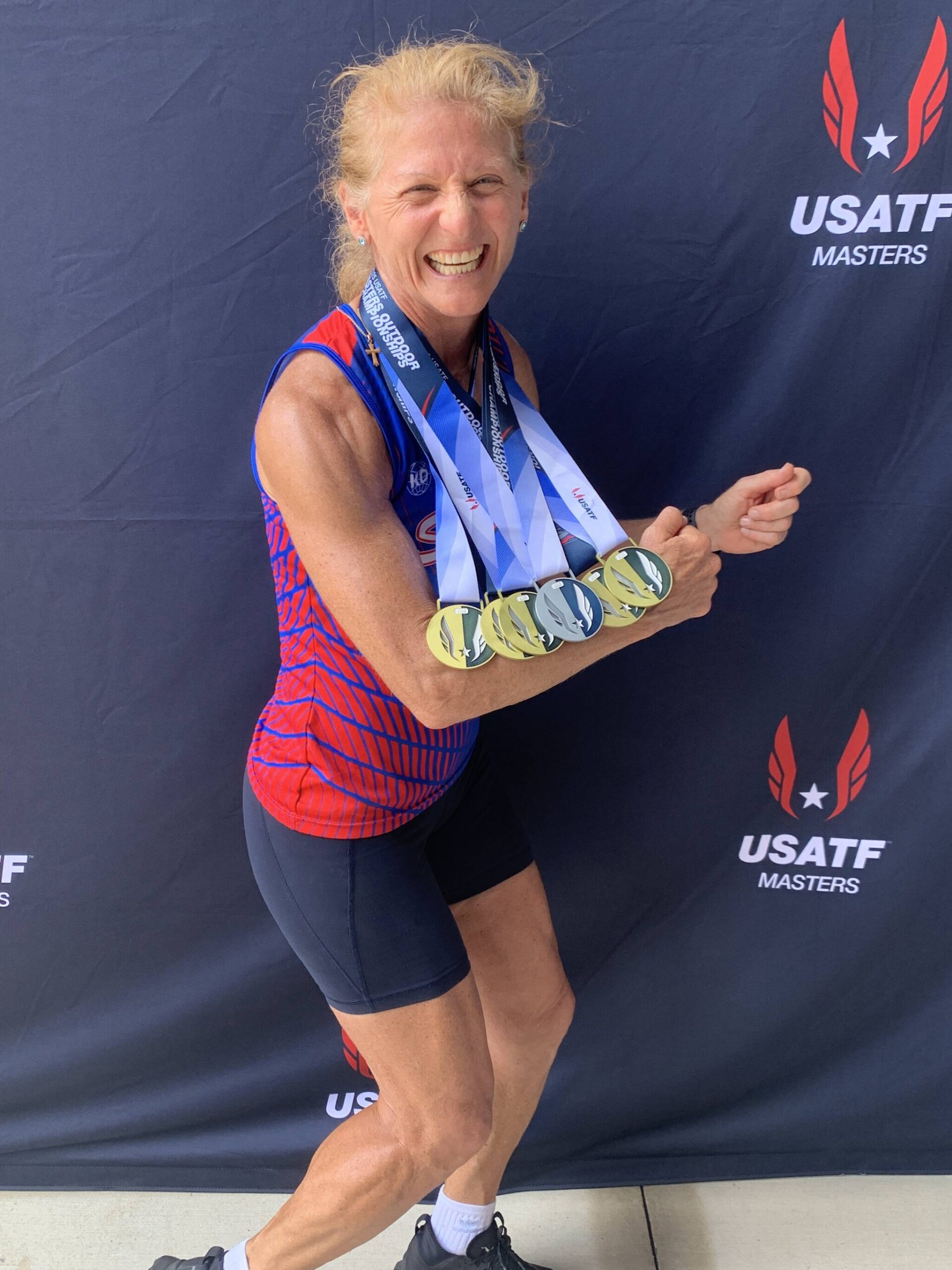 Donna Beard poses with her medals from the 2025 USA Track & Field Master's Outdoor Championships, which took place in Huntsville, Alabama from July 17-20, 2025. (Photo courtesy Chris Beard)