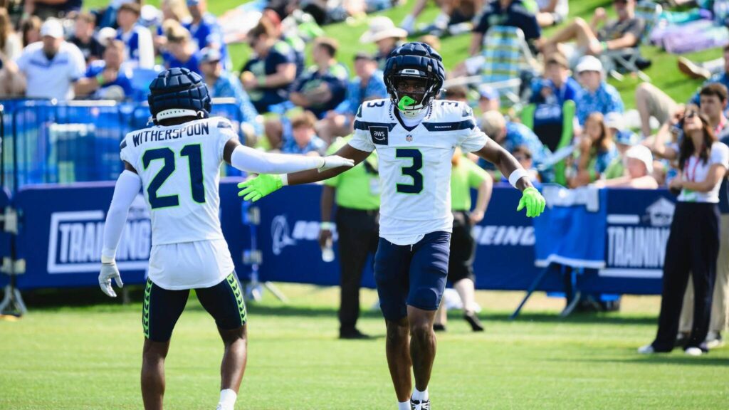 Seahawks safety Nick Emmanwori (3) high-fives cornerback Devon Witherspoon (21) at Seahawks practice at the Virginia Mason Athletic Center in Renton, Washington on July 31, 2025. (Photo courtesy of Edwin Hooper / Seattle Seahawks)
