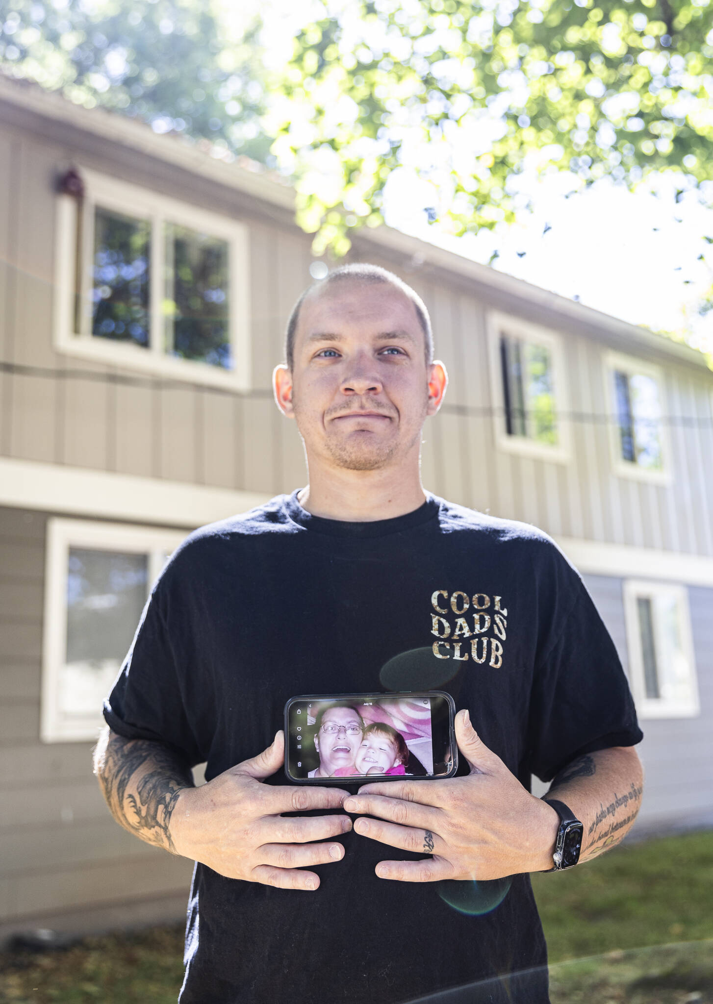 Jake Graham of Puyallup holds a photograph of his mother, Poppy, who died in Renton in 2010 when he was 17. Her ashes, recently discovered in the garage of a Lake Stevens rental home, are now with him. (Olivia Vanni / The Herald)
Jake Graham holds a photograph of his mother Poppy Graham on Monday, Aug. 11, 2025 in Everett, Washington. (Olivia Vanni / The Herald)
