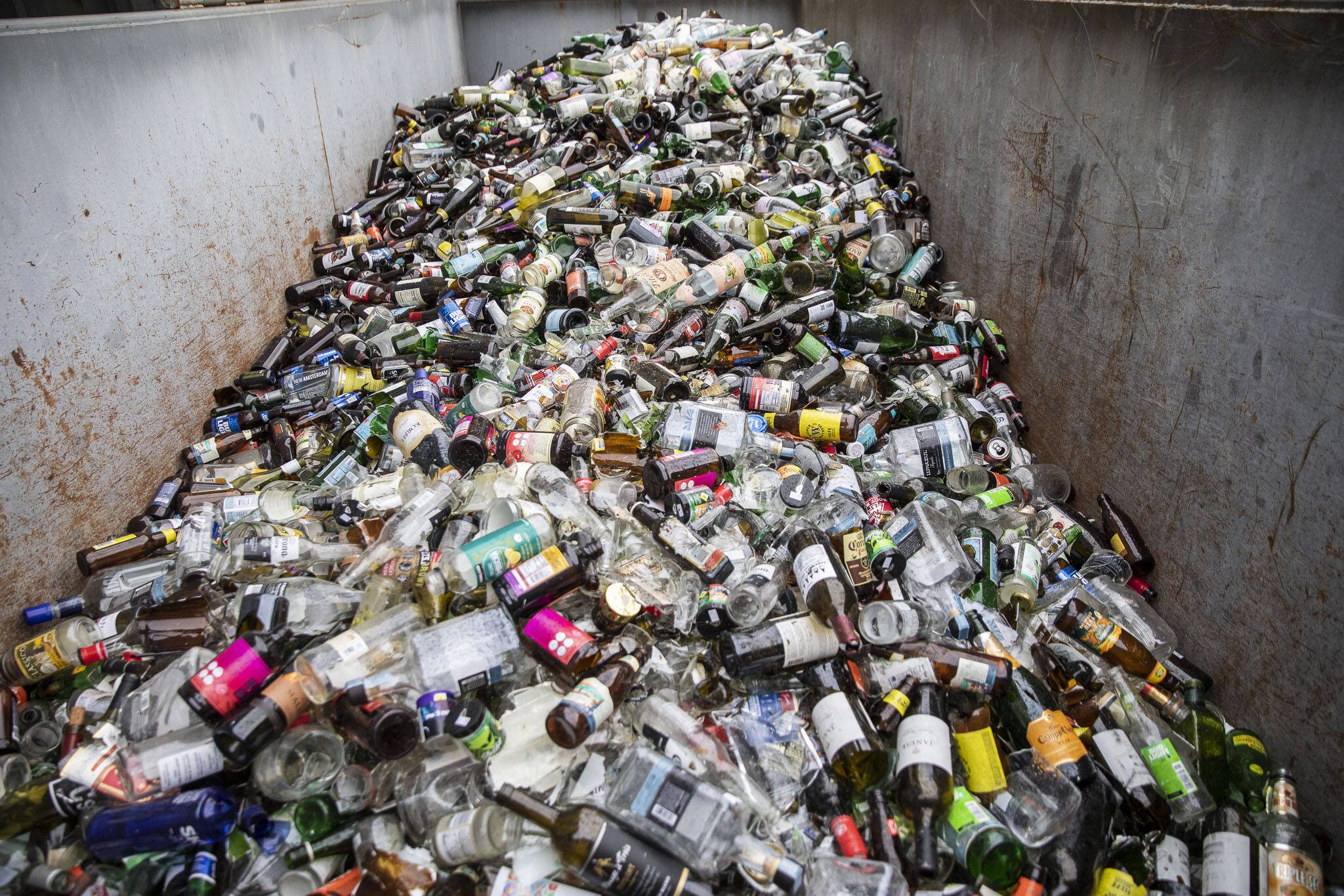 Glass recycling at Airport Road Recycling & Transfer Station on Thursday, Nov. 30, 2023 in Everett, Washington. (Olivia Vanni / The Herald)
