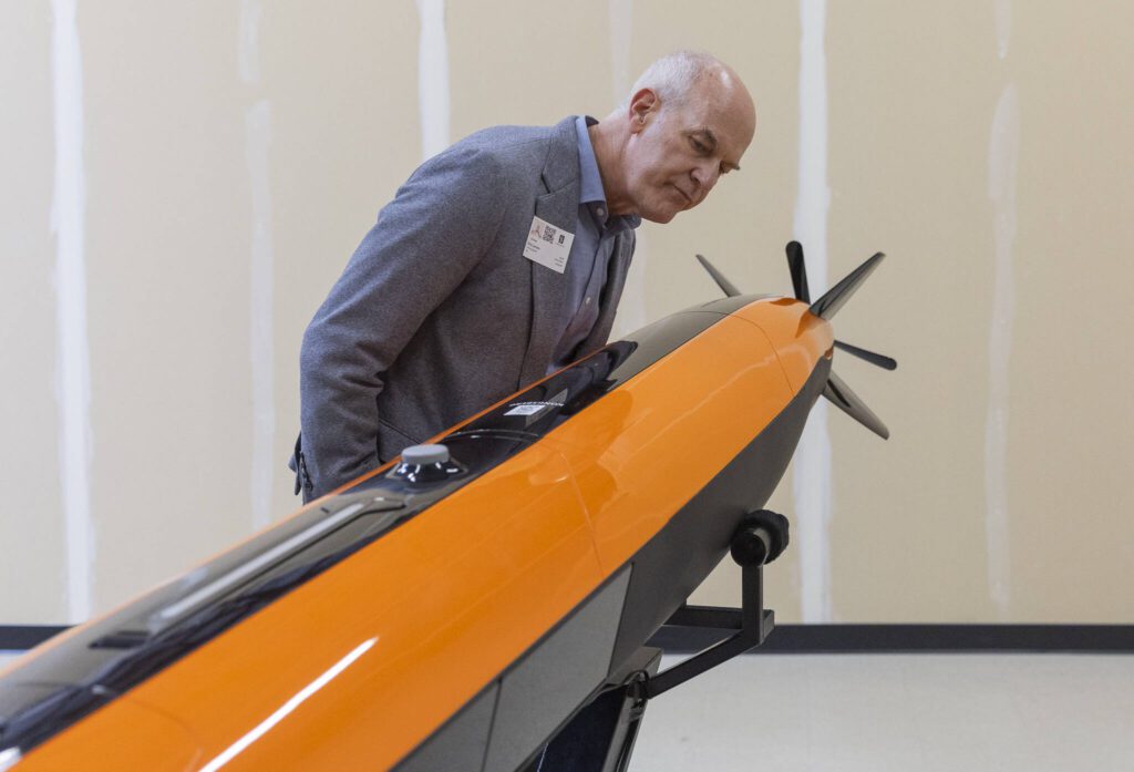 Rep. Rick Larsen looks at the HUGIN Edge on Thursday, July 31, 2025 in Lynnwood, Washington. (Olivia Vanni / The Herald)
