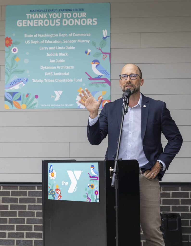 YMCA of Snohomish County CEO Peyton Tune speaks the the ribbon cutting for the new Marysville Family YMCA Early Learning Center on Tuesday, Aug. 5, 2025 in Marysville, Washington. (Olivia Vanni / The Herald)
