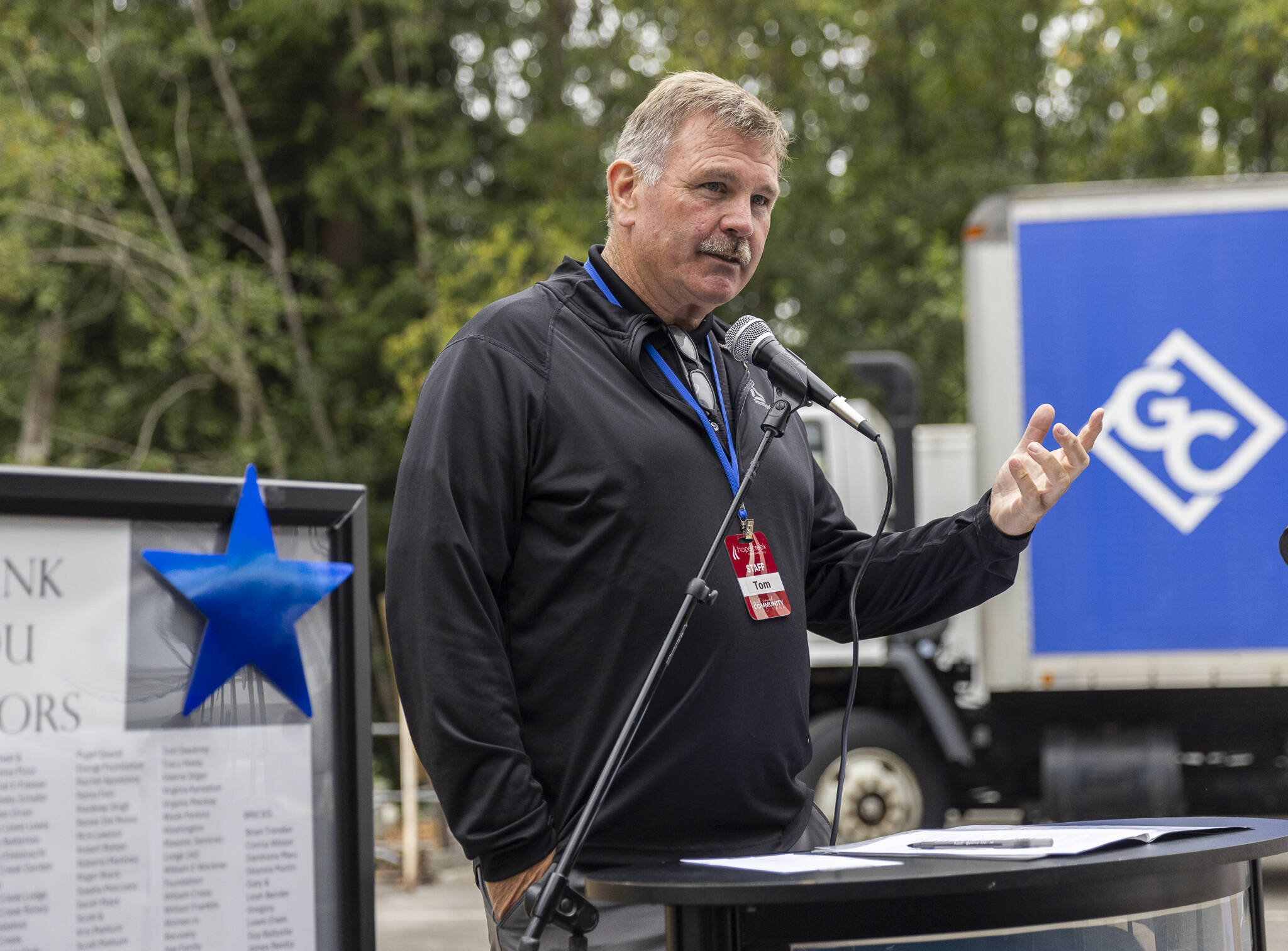 Hope Creek Executive Director Tom Sweeney speaks at the groundbreaking for the new Mill Creek Community Food Bank site on Monday, Aug. 4, 2025 in Mill Creek, Washington. (Olivia Vanni / The Herald)