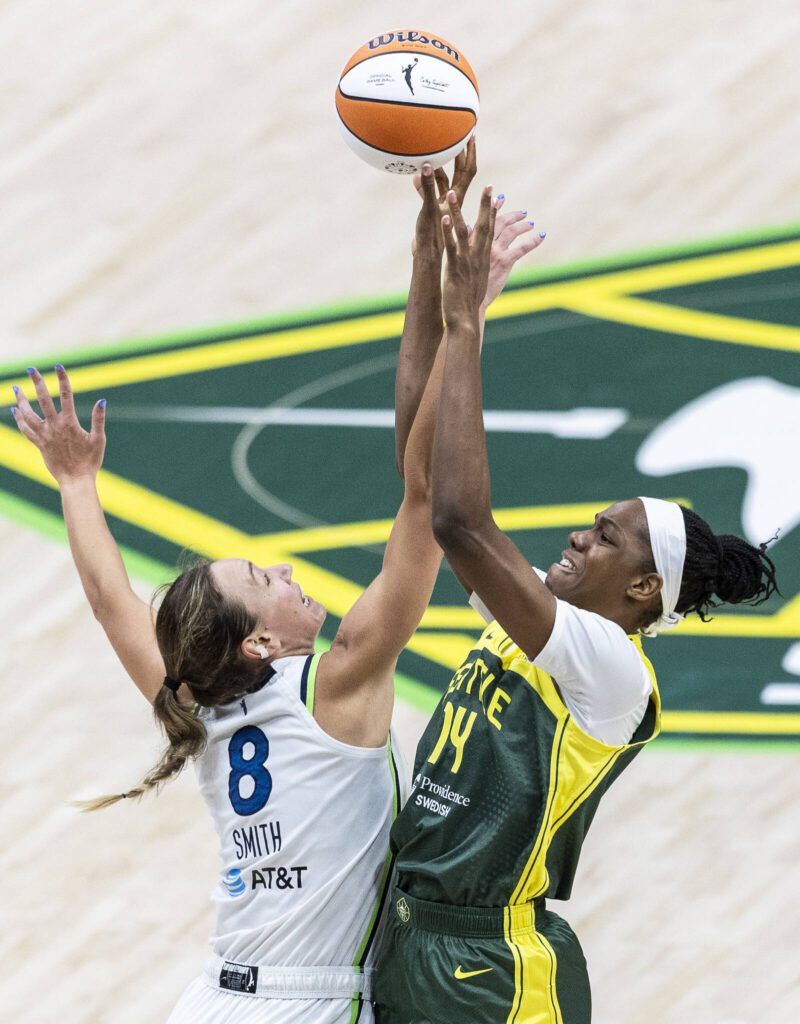 Minnesota Lynx&rsquo;s Alanna Smith and Seattle Storm&rsquo;s Dominique Malonga jump in the air for a loose ball during the game on Tuesday, Aug. 5, 2025 in Seattle, Washington. (Olivia Vanni / The Herald)

