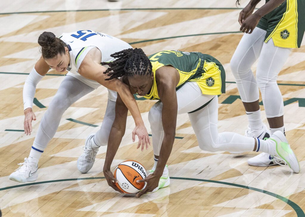 Seattle Storm&rsquo;s Nneka Ogwumike scrambles after the ball with Minnesota&rsquo;s Jessica Shepard during the game on Tuesday, Aug. 5, 2025 in Seattle, Washington. (Olivia Vanni / The Herald)
