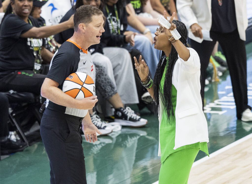 Seattle Storm head coach Noelle Quinn talks with the referee after a mistaken whistle during the game against the Minnesota Lynx on Tuesday, Aug. 5, 2025 in Seattle, Washington. (Olivia Vanni / The Herald)
