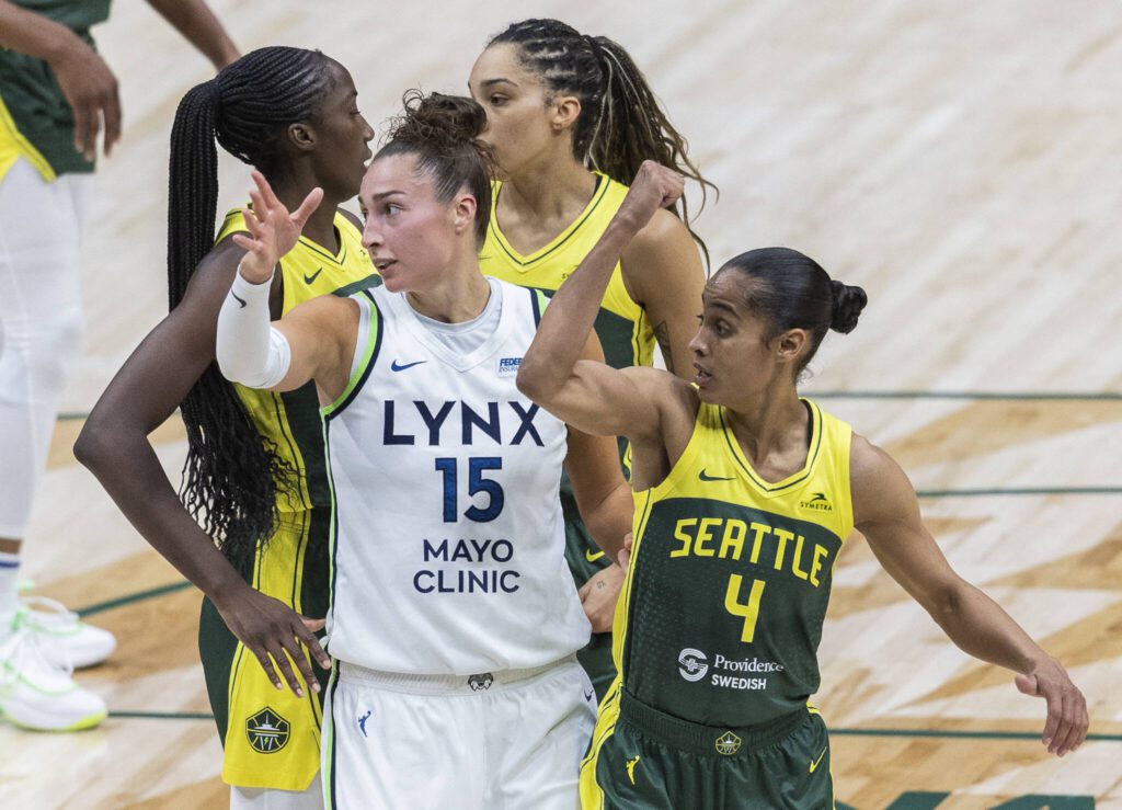 Seattle Storm&rsquo;s Skylar Diggins and Minnesota&rsquo;s Jessica Shepard gesture to the referees for possession and a foul during the game on Tuesday, Aug. 5, 2025 in Seattle, Washington. (Olivia Vanni / The Herald)

