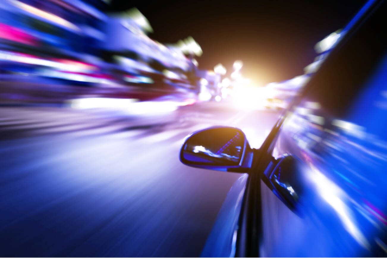 Night drive with motion blur city background
