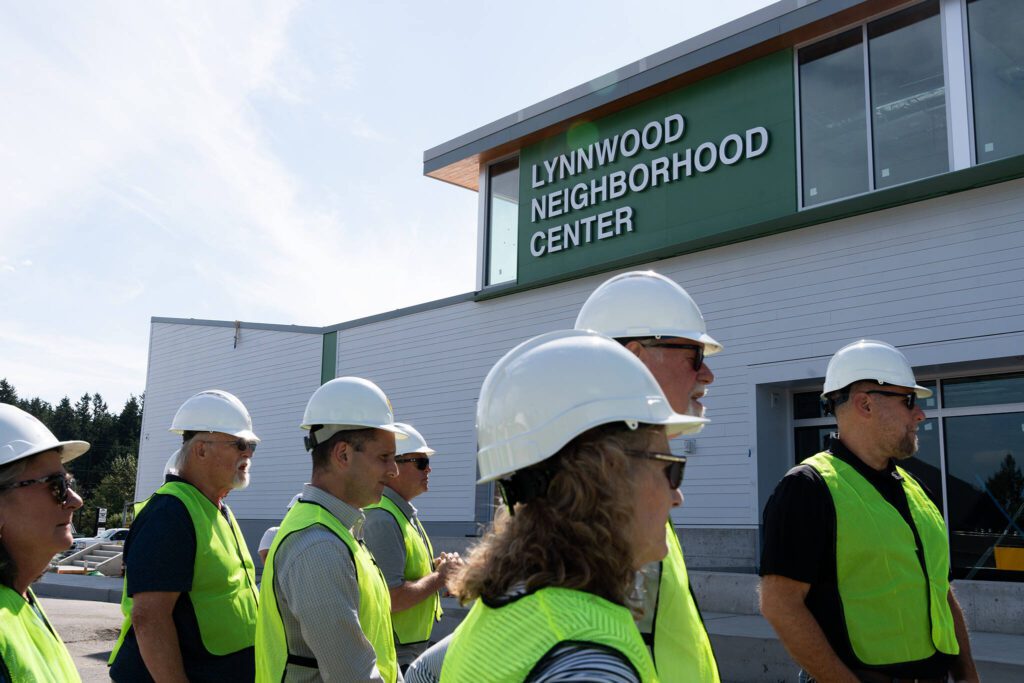Members of local Rotary clubs tour the Lynnwood Neighborhood Center on Thursday, Aug. 14 in Lynnwood, Washington. (Will Geschke / The Herald)

